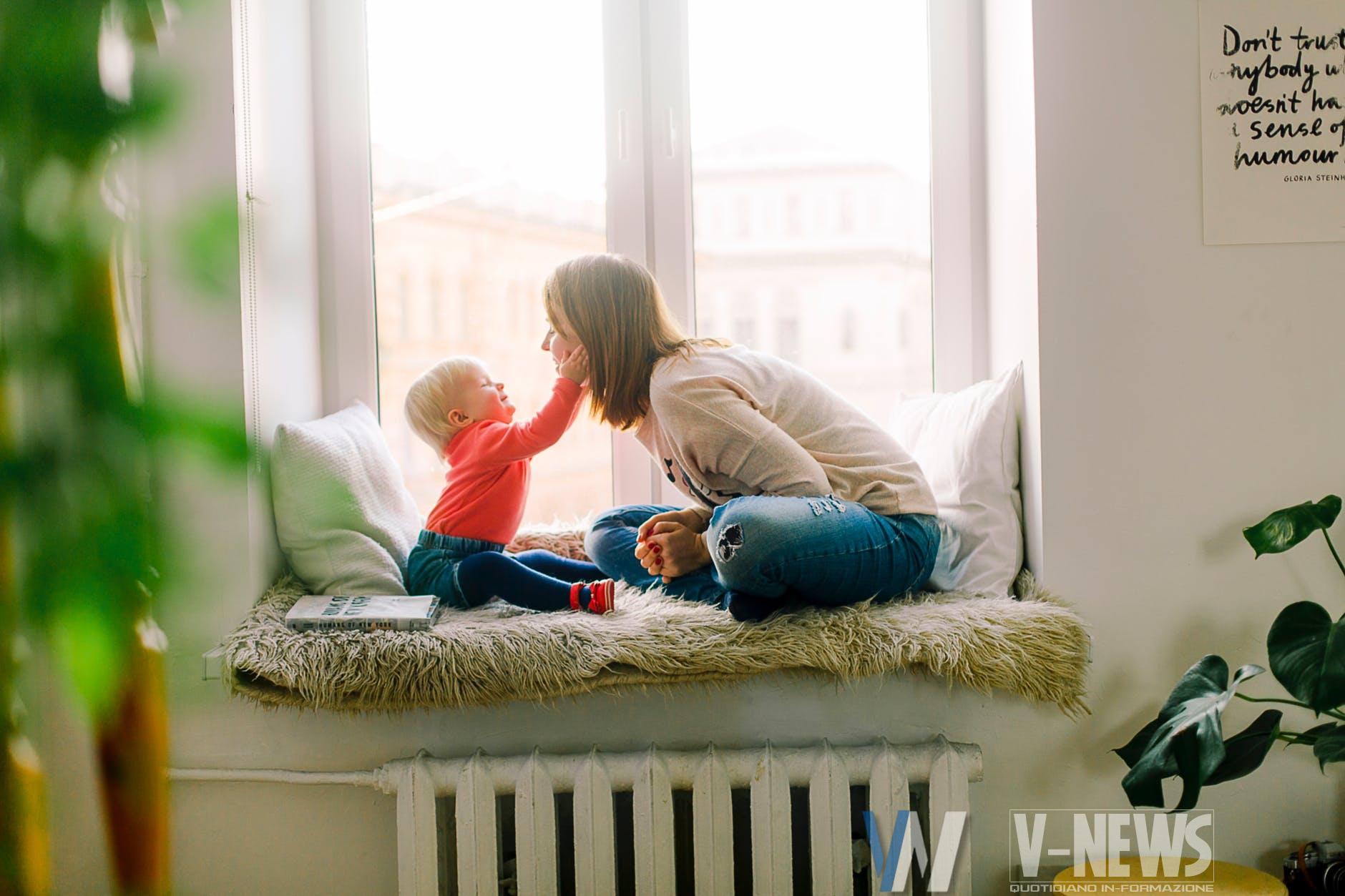 baby touching woman s face